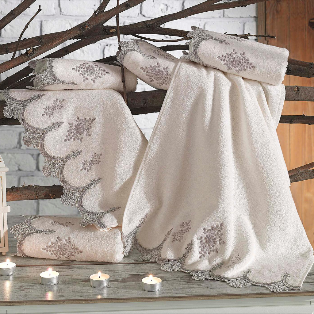 Romantic bathroom decorated with candles and luxurious hand towels